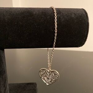 Silver tone bracelet with heart shaped charm